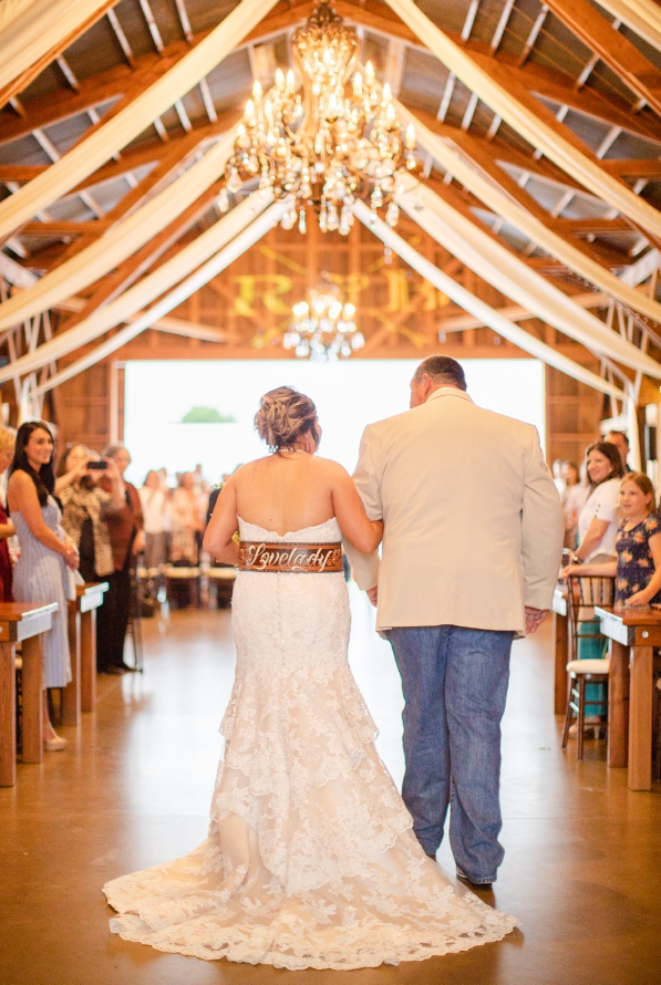 bride and father walking down aisle